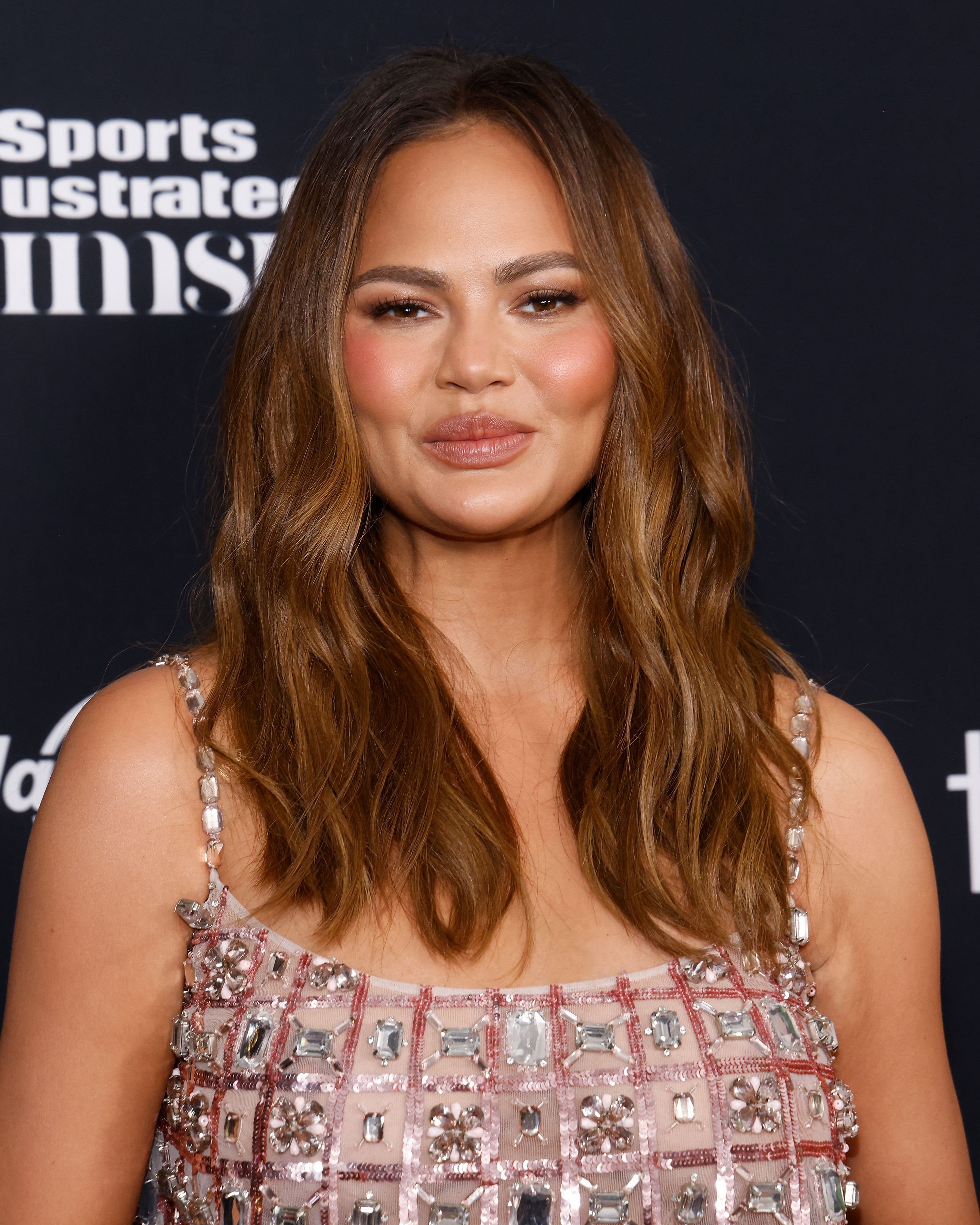 Chrissy Teigen (seen here in May) has admitted to using masseter Botox, and her jawline looks tighter, according to nurse practitioner Jackie Spagnuolo