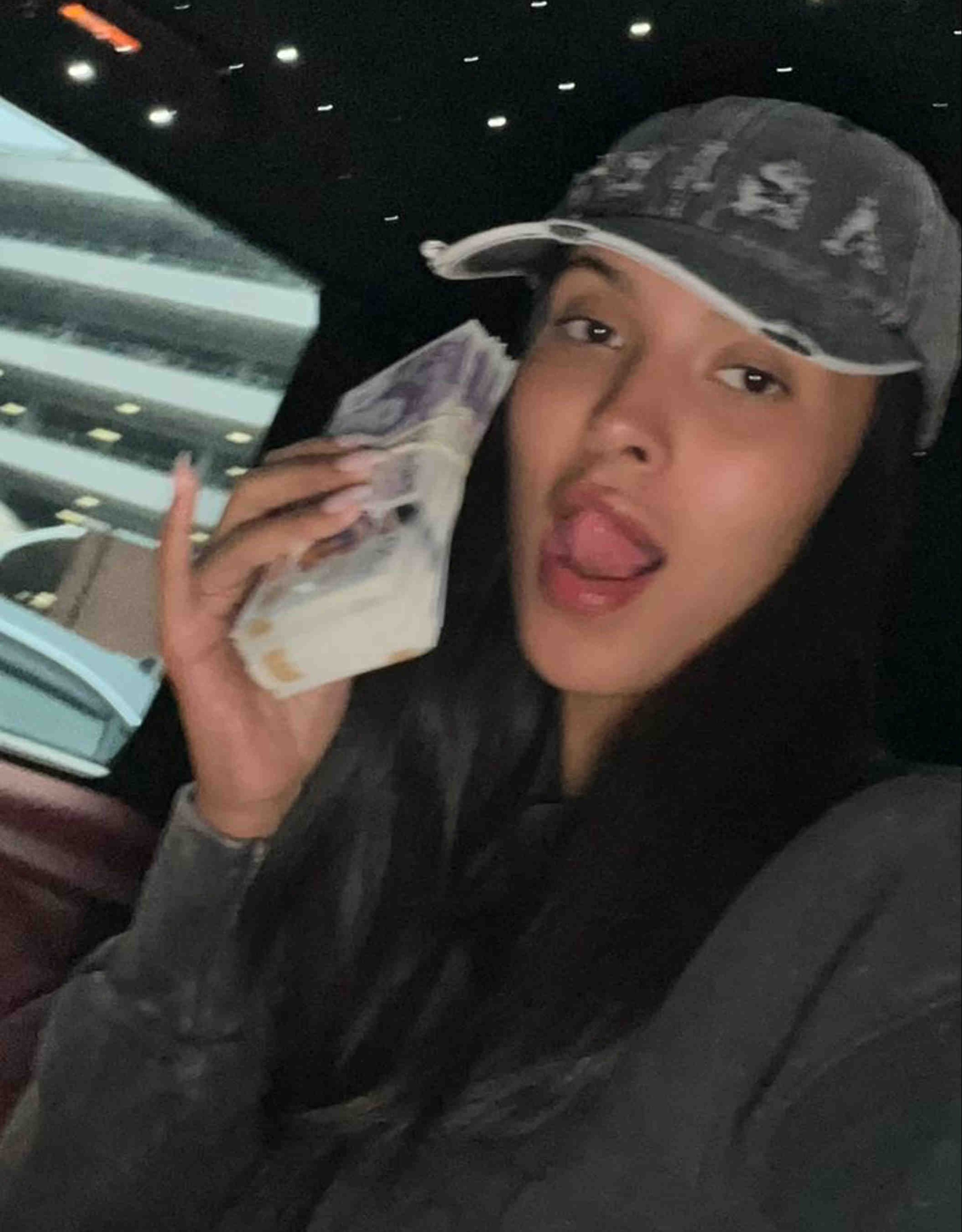 Maya posted a tongue-in-cheek pic to Instagram showing her posing with a wad of cash