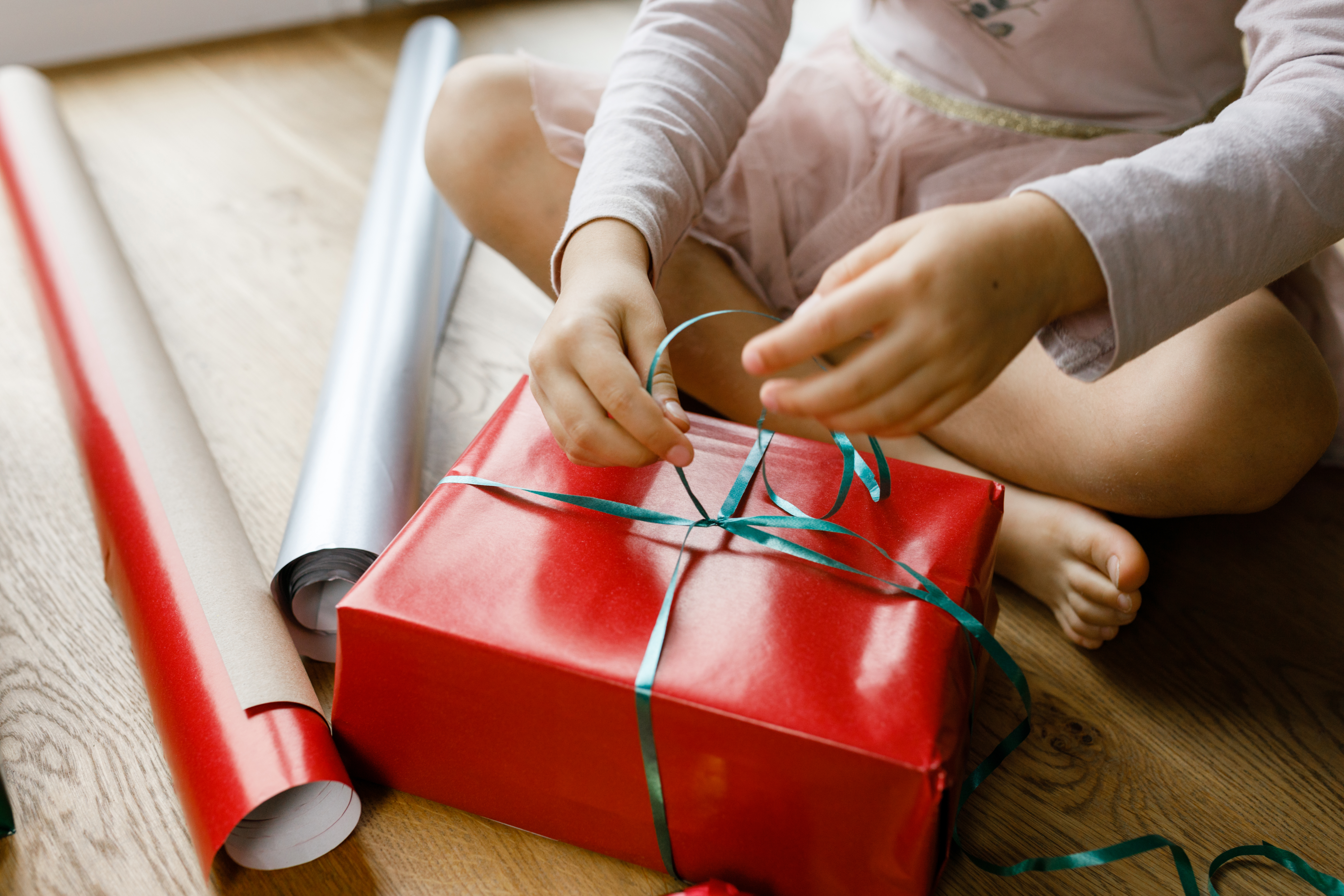 The mother even encourages parents to reuse gift bags and wrapping paper