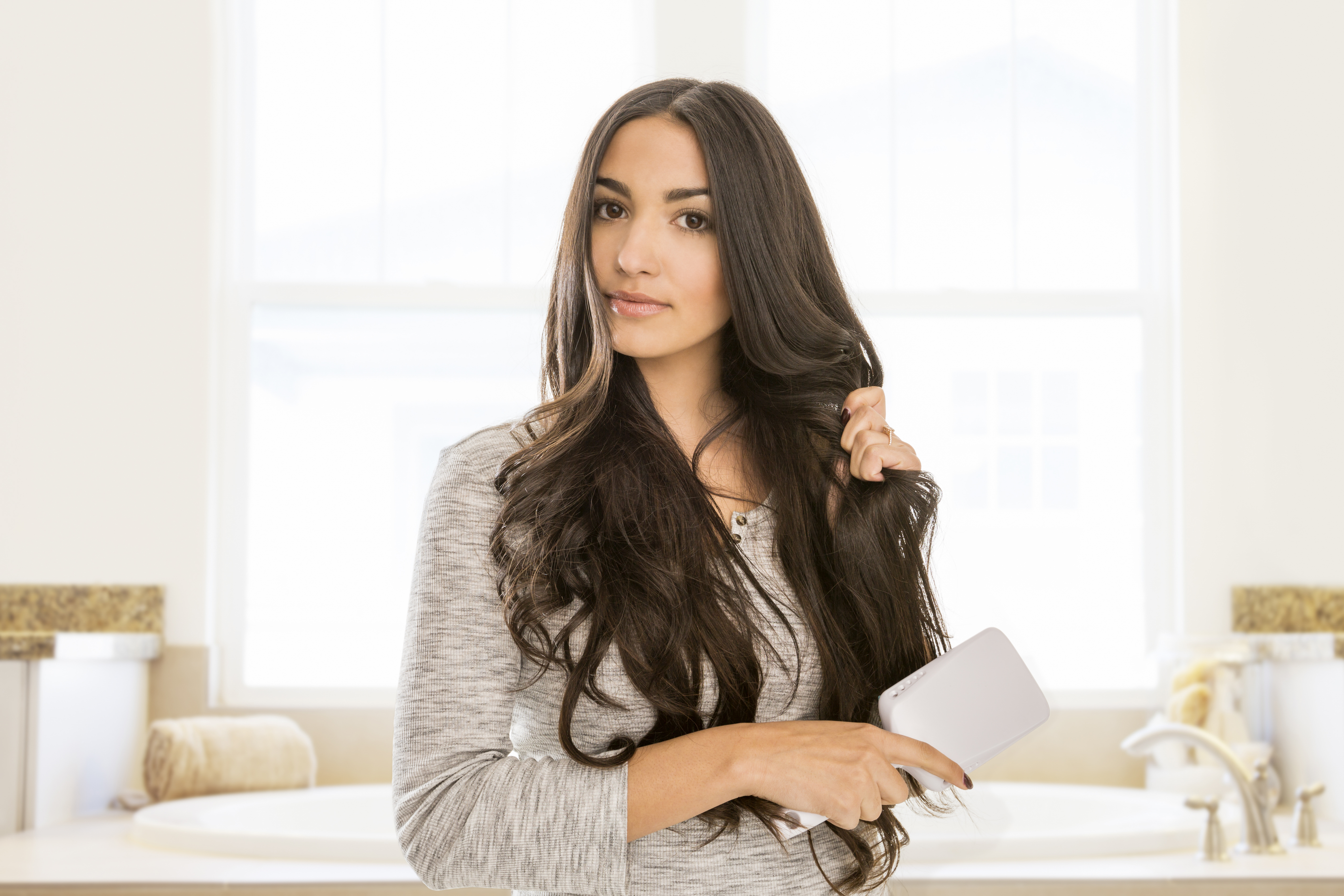 Karelina said it's best to embrace your natural hair texture to avoid damage to your locks (stock image)