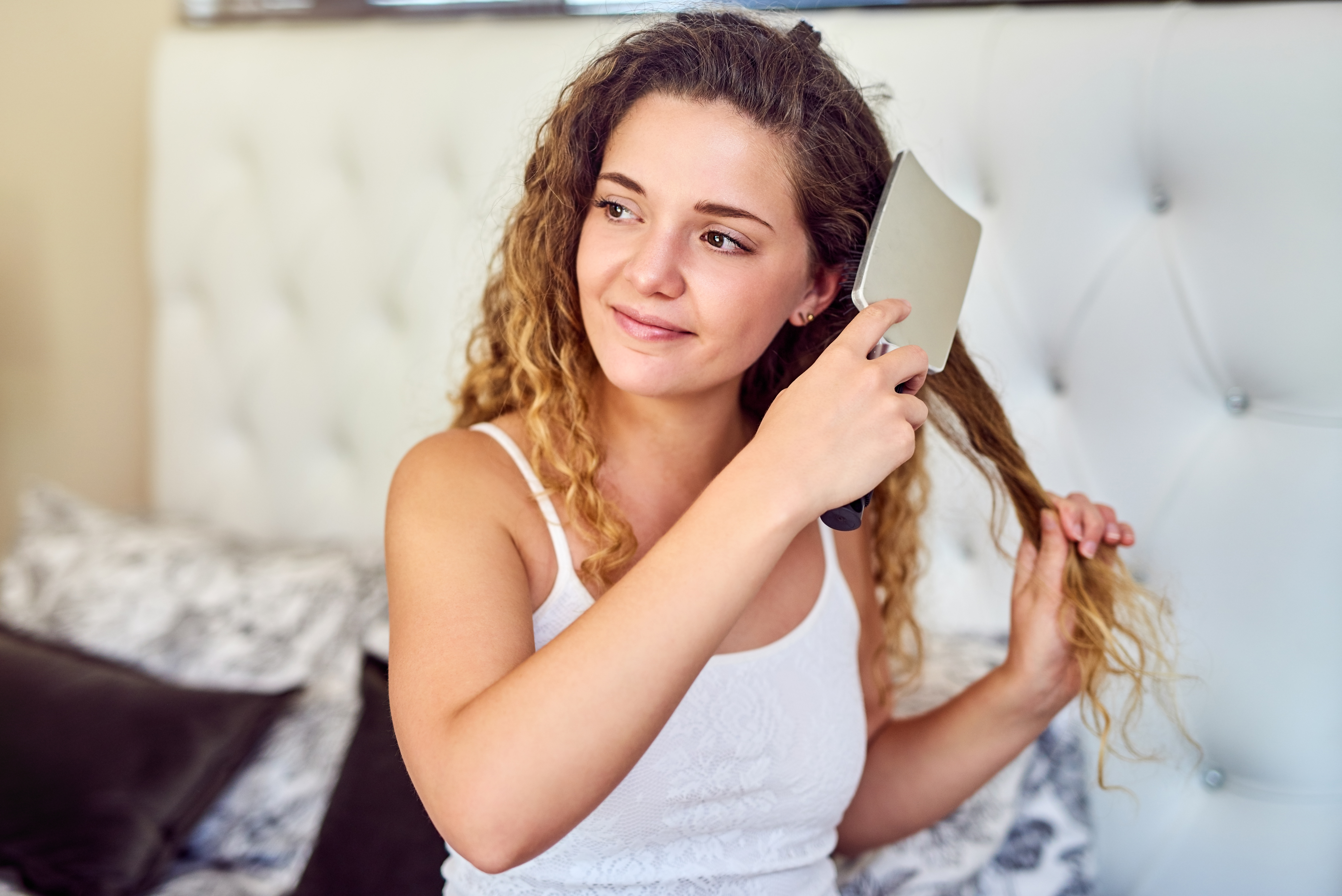 A woman with curly hair shared a hair care trick that saved her money (stock photo)