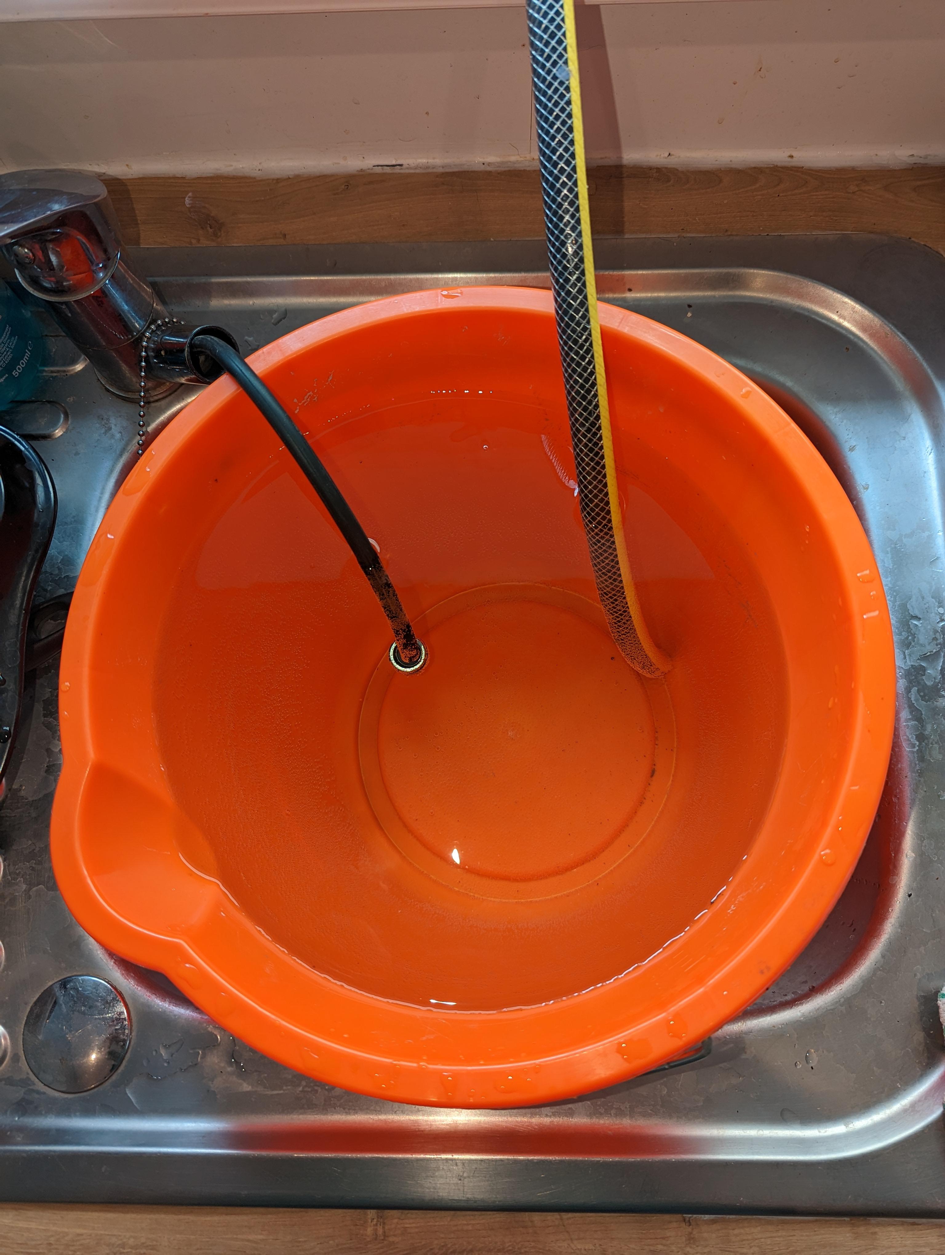 They used a bucket to siphon water from their sink into the kiddie pool outside