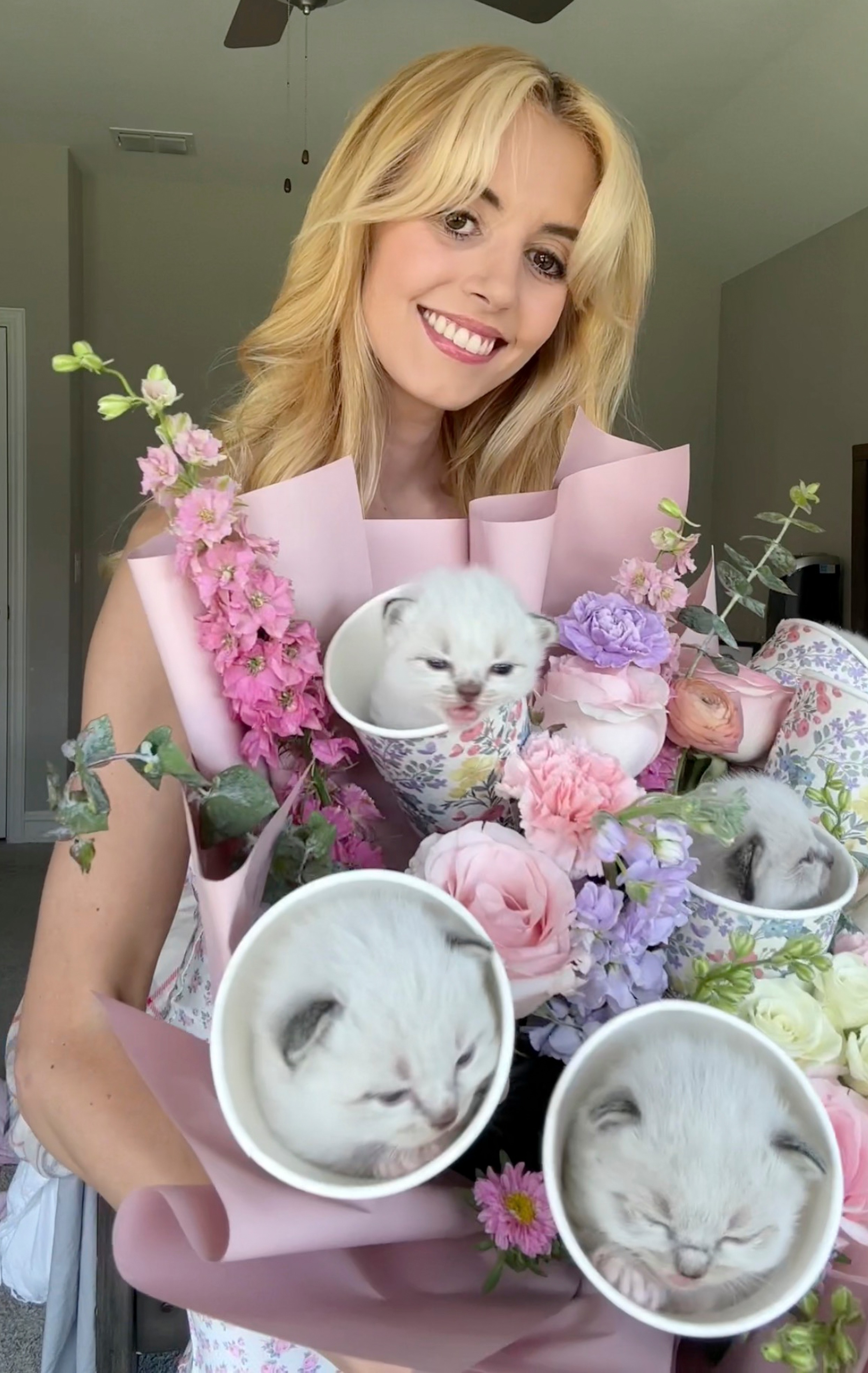 Pearl, a cat mom with 20 cats and kittens, showed off the 