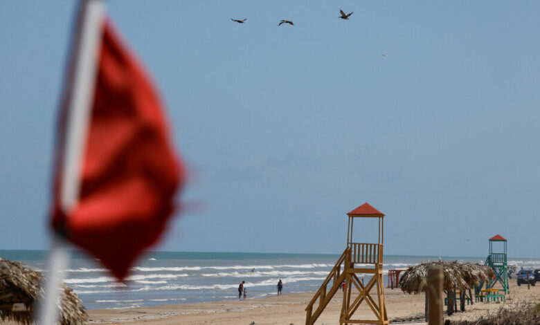 Some in Mexico are taking precautions for Beryl, while others are enjoying the beach