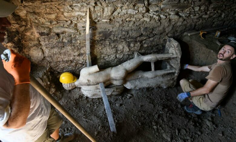 Archaeologists find marble statue in ancient Roman sewer