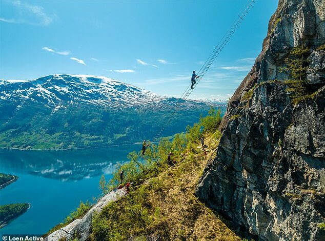 Pictured: The nail-biting mountain ladder in Norway, 2,600 feet above sea level – with people climbing it appearing to ‘float in the air’. Would YOU dare to tackle it?