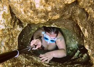 Astonishing videos show a freediver crawling through terrifyingly small holes and exploring sunken planes and buses