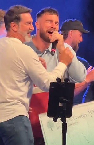 Travis Kelce dedicates karaoke win to Taylor Swift as fans go wild over his cringe-worthy performance of iconic rock song