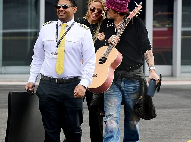 Johnny Depp is seen making out with a mysterious blonde woman as he leaves London Heliport – two years after Amber Heard’s trial