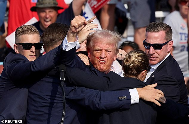 Gunman killed, spectator dead as bullets fly at Trump rally, leaving former president with huge gash above his ear and blood across his face