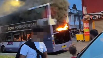 Rioters set fire to bus and vandalise police car on shameful night in Leeds: Residents are asked to stay indoors as huge crowds tear through streets after confrontation with dozens of officers