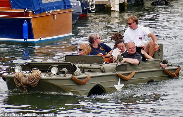 I feel like we shouldn’t be here! Classic amphibious vehicles sail up the Thames for the annual Traditional Boat Festival