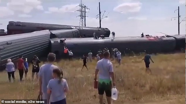 Train collides with truck at railway crossing, killing two and injuring 100 in Russia