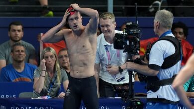 Team GB swimmer drops to the floor in despair as he is thrown out of the Olympics despite finishing in first after he broke little-known rule in 200m backstroke heats