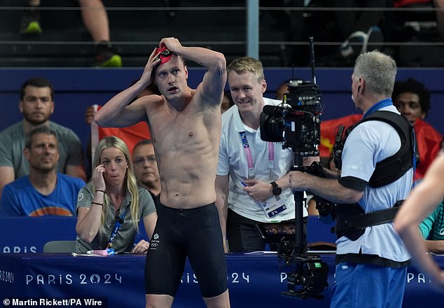 Team GB swimmer drops to the floor in despair as he is thrown out of the Olympics despite finishing in first after he broke little-known rule in 200m backstroke heats