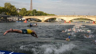 One triathlete prepares for a dirty Seine by not washing his hands