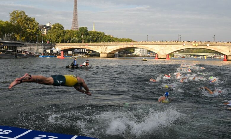 One triathlete prepares for a dirty Seine by not washing his hands