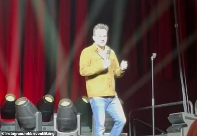 Tense moment as HBF stadium crowd threateningly approaches famous Australian comedian and 1% Club presenter Jim Jefferies over Donald Trump joke