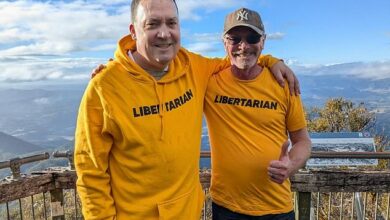 Wollumbin-Mount Warning: Act of defiance as state MP and protester ignore ban on climbing Indigenous landmark in secret early morning hike – a day after one of them was fined for breaking the rule