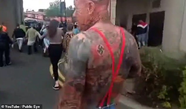 Britain’s disturbing underbelly of Southport tragedy: How far-right groups orchestrated violent riots on streets across the country – footage emerges of protester proudly displaying Nazi tattoo