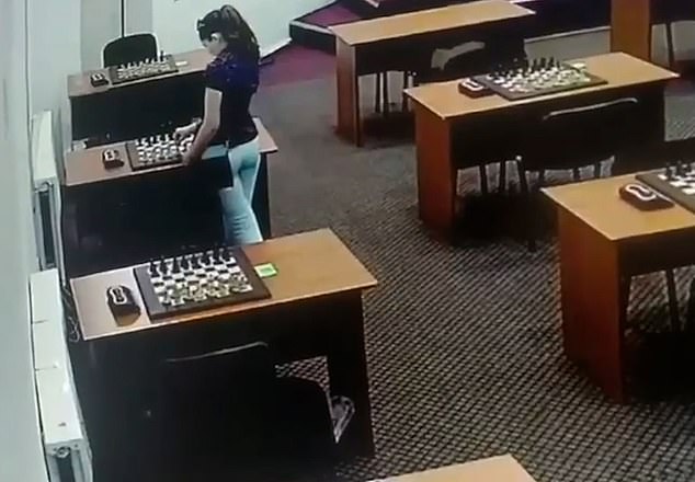 Russian chess champion caught on CCTV lathering chess pieces with mercury to poison her childhood rival before match