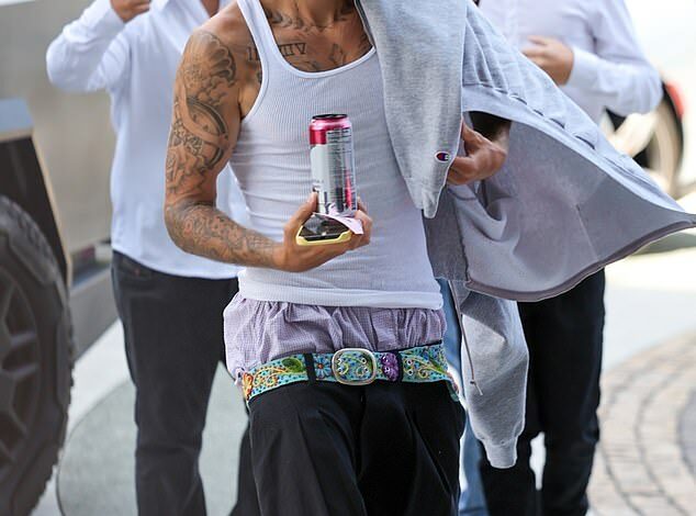 Justin Bieber looks unrecognizable in scruffy attire with his boxer shorts showing at posh Waldorf Astoria in LA without pregnant wife Hailey – after sparking concern among fans