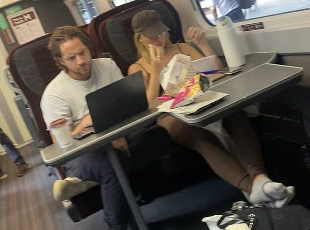 Hollywood star looks unrecognisable as she eats a Pret sandwich on the train to Edinburgh. But can you guess who it is?