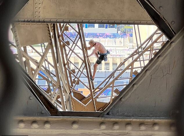 Eiffel Tower evacuated after man caught climbing iconic Paris landmark hours before Olympic Games closing ceremony