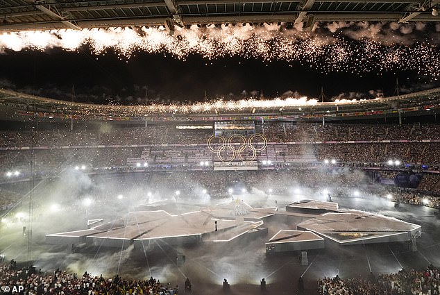 Olympics closing ceremony: Golden ‘bee-man’ joins floating PIANIST and ‘toilet roll mummies’ with rocker crowd surfing above athletes during wacky performance ahead of show stoppers by Tom Cruise and Billie Eilish