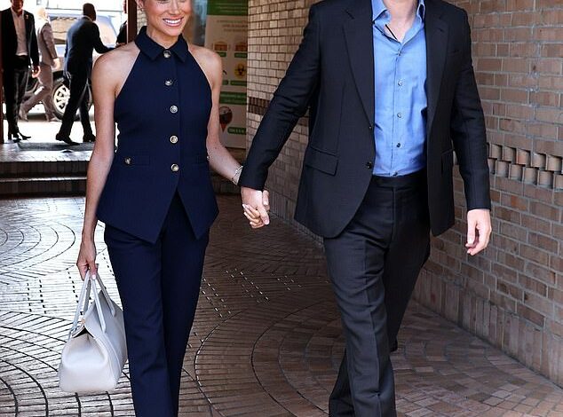 Meghan Markle means business! Duchess of Sussex sports £596 navy collared vest from Veronica Beard as she arrives in Colombia with Prince Harry