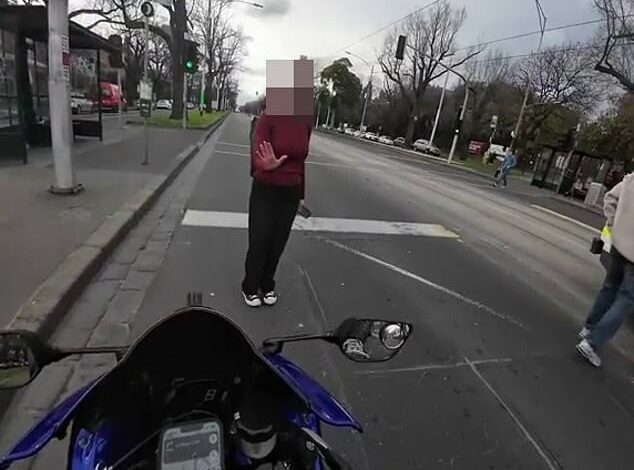 A heated debate erupts over who was at fault in a collision between a motorcyclist and a ‘Karen’ who boarded a Melbourne tram at Parkville