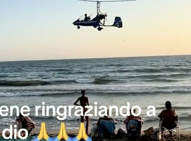 Dramatic moment as low-flying gyrocopter crashes into sea near shocked beach sunbathers and swimmers – officials say it was ‘only a coincidence that it didn’t end in tragedy’