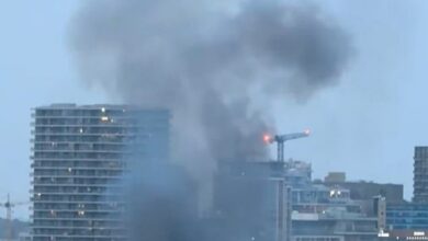 Film crew causes mass panic as huge fire and ‘five explosions’ rock the Thames just a stone’s throw from London’s O2 arena, blanketing the area in thick smoke: Police call it ‘pre-planned’ – but firefighters rush to the scene to tackle blaze