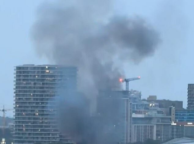 Film crew causes mass panic as huge fire and ‘five explosions’ rock the Thames just a stone’s throw from London’s O2 arena, blanketing the area in thick smoke: Police call it ‘pre-planned’ – but firefighters rush to the scene to tackle blaze