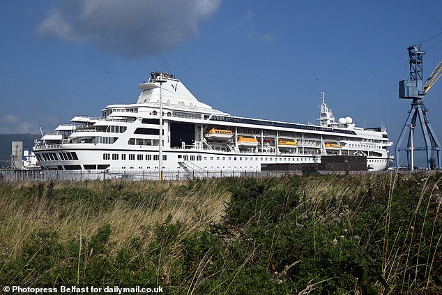 Cruise ship Odyssey FINALLY sets sail, three months after its £27,000-a-month passengers were stranded in Belfast (but still no start date for their three-year round-the-world voyage)