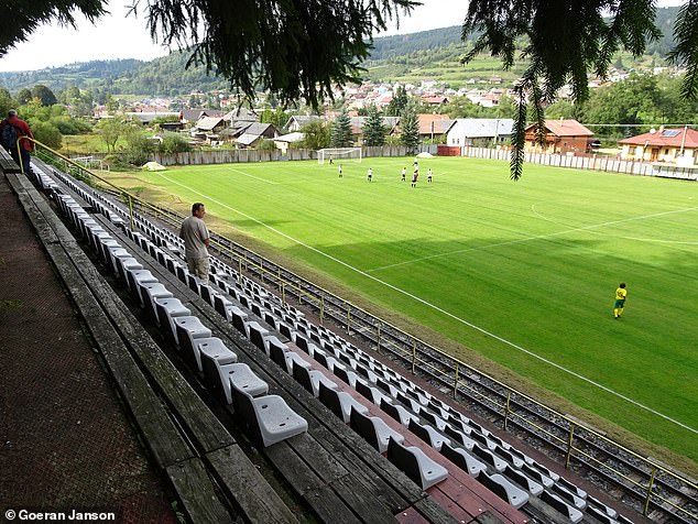 Pictured: Five of the most bizarre football stadiums in the world, from one in the UK with entrances in a row of houses to one with a RAILWAY through it