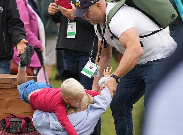 Royal villains! Mike Tindall breaks up a play fight between daughter Lena, 6, and son Lucas, 3, as the family arrive to cheer on Zara at the Burghley Horse Trials