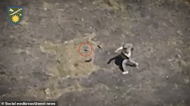 Russian soldier avoids death by THROWING his assault rifle at a Ukrainian drone, setting off its explosives a split second before it would have killed him