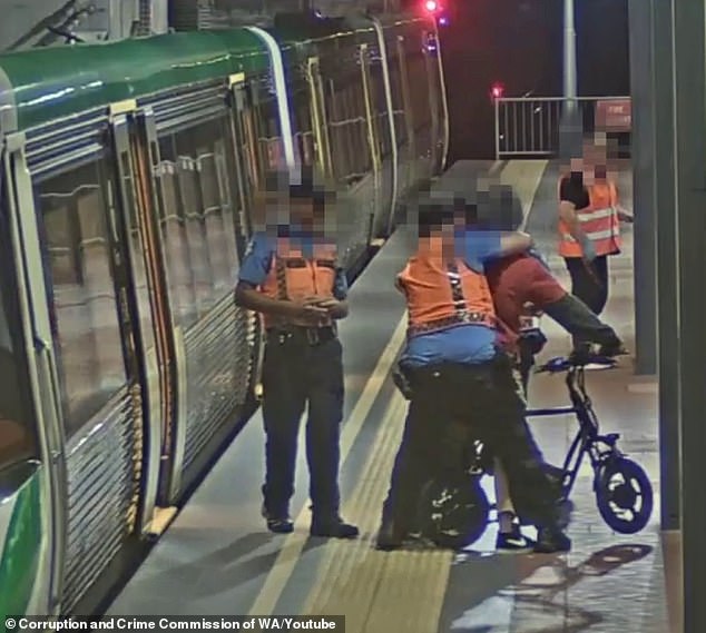 Wild moment cyclist is tackled to the ground by Perth transit officers at train station