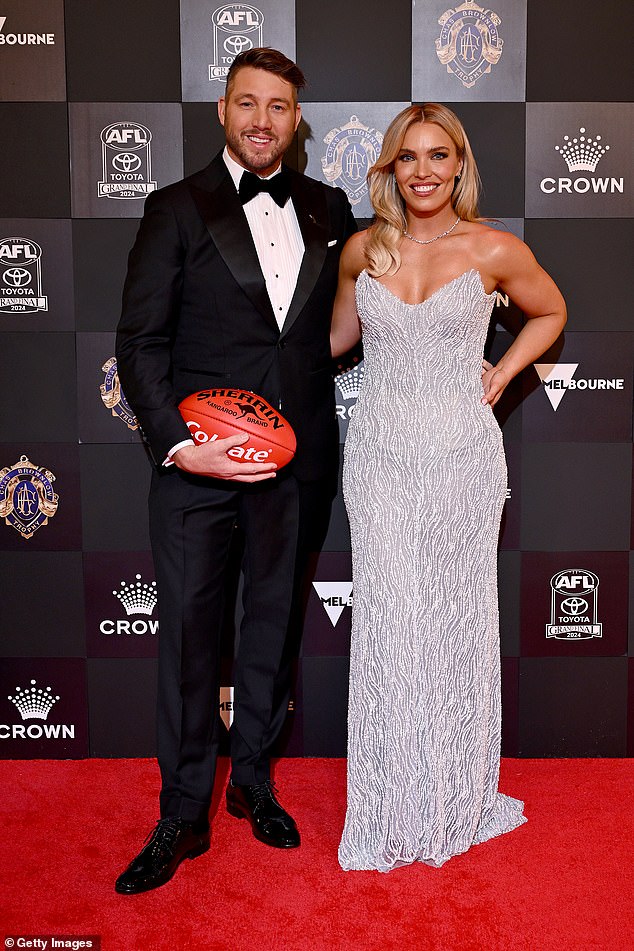 Abbey Holmes stuns in a glistening silver gown as she and Dale Thomas lead arrivals at Brownlow Medal 2024 as AFL’s night of nights kicks off at Crown Melbourne