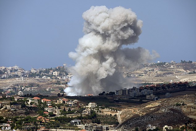 Israeli warplanes hit Hezbollah in massive wave of bombardments as IDF warns Lebanese civilians to stay away from targets amid growing fears of wider war in Middle East