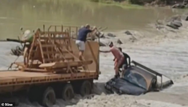 Watch the shocking moment a daring crossing over crocodile-infested waters nearly ends in tragedy