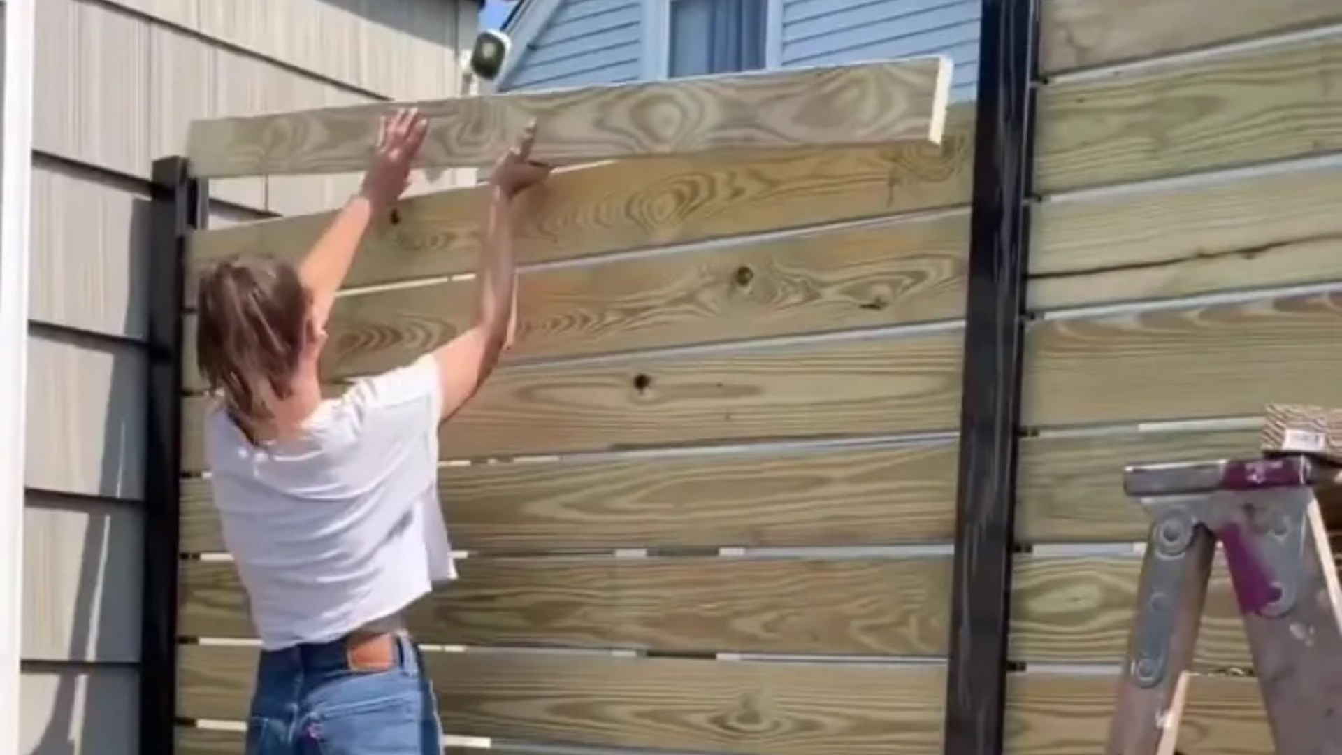 I was tired of people peeping into my yard, so I made a simple privacy fence myself