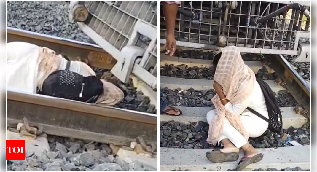 Watch: Girl Who Wants to Commit Suicide on Railway Tracks Finally Falls Asleep; Narrowly Survives | India News – Times of India