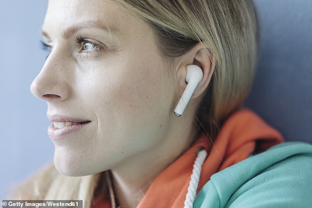 Why your earbuds are making noise as loud as a CHAINSAW and could be making you deaf, experts warn