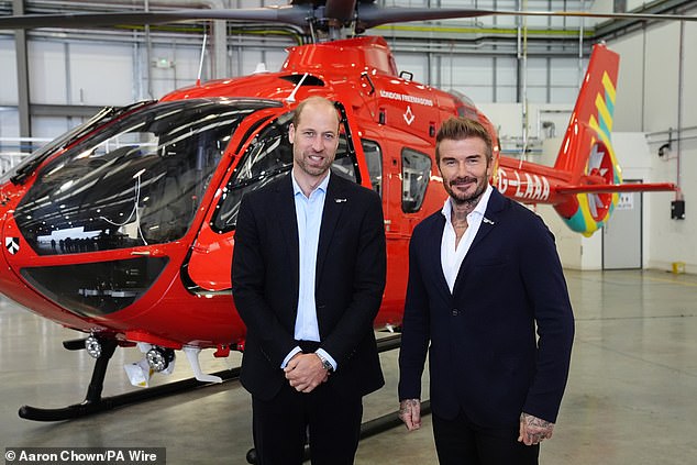 Prince of Wales is joined by David Beckham in the cockpit of a helicopter as he visits the Air Ambulance Charity