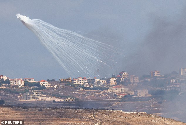 Hezbollah unleashes 100 rockets into Israel as IDF calls up more troops and orders more Lebanese villages to evacuate as it continues invasion hours after Iranian missile barrage