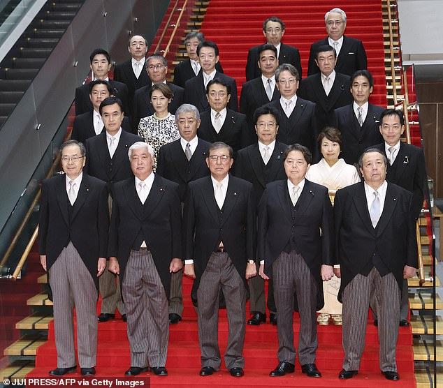 Can you find out why angry Japanese officials demanded this photo of ministers be edited?