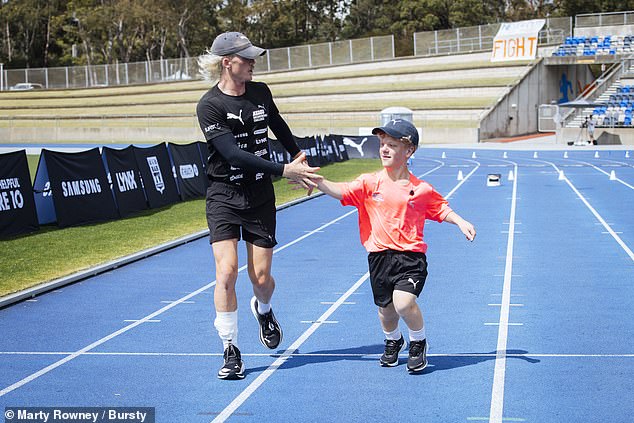 Teenager BANNED from competitive running because he has dwarfism in the clouds after meeting Australian cult hero Nedd Brockmann