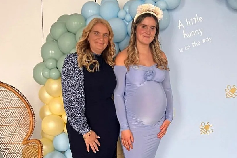 Katie Radford shows off her growing bump at a baby shower with mum-of-22 Sue